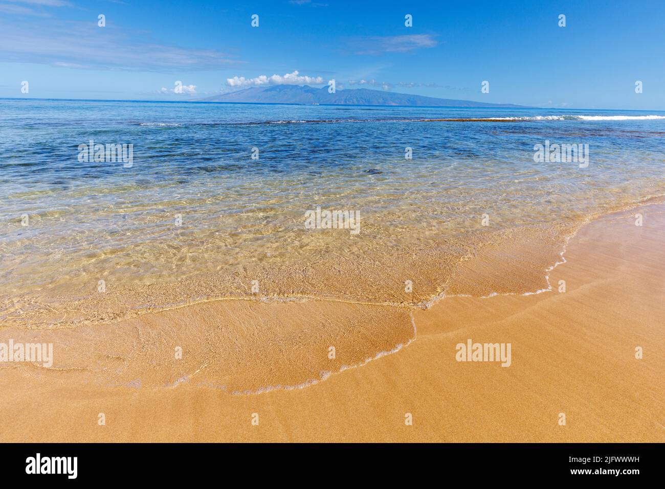 Honokowai beach with calm waves and the island of Molokai in the background, Maui, Hawaii. Stock Photo