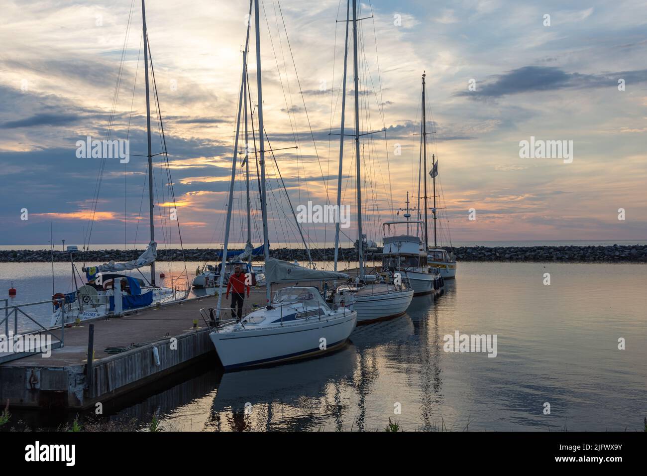 Sailboats in the harbor on a summer night Stock Photo - Alamy