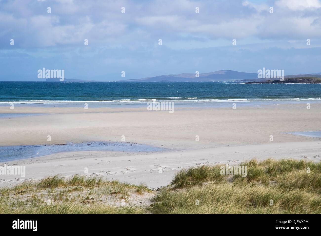 A spectacular view from the West Beach area of North Uist, Outer Hebrides showing the pristine white sand and brilliant blues of the sea and sky Stock Photo