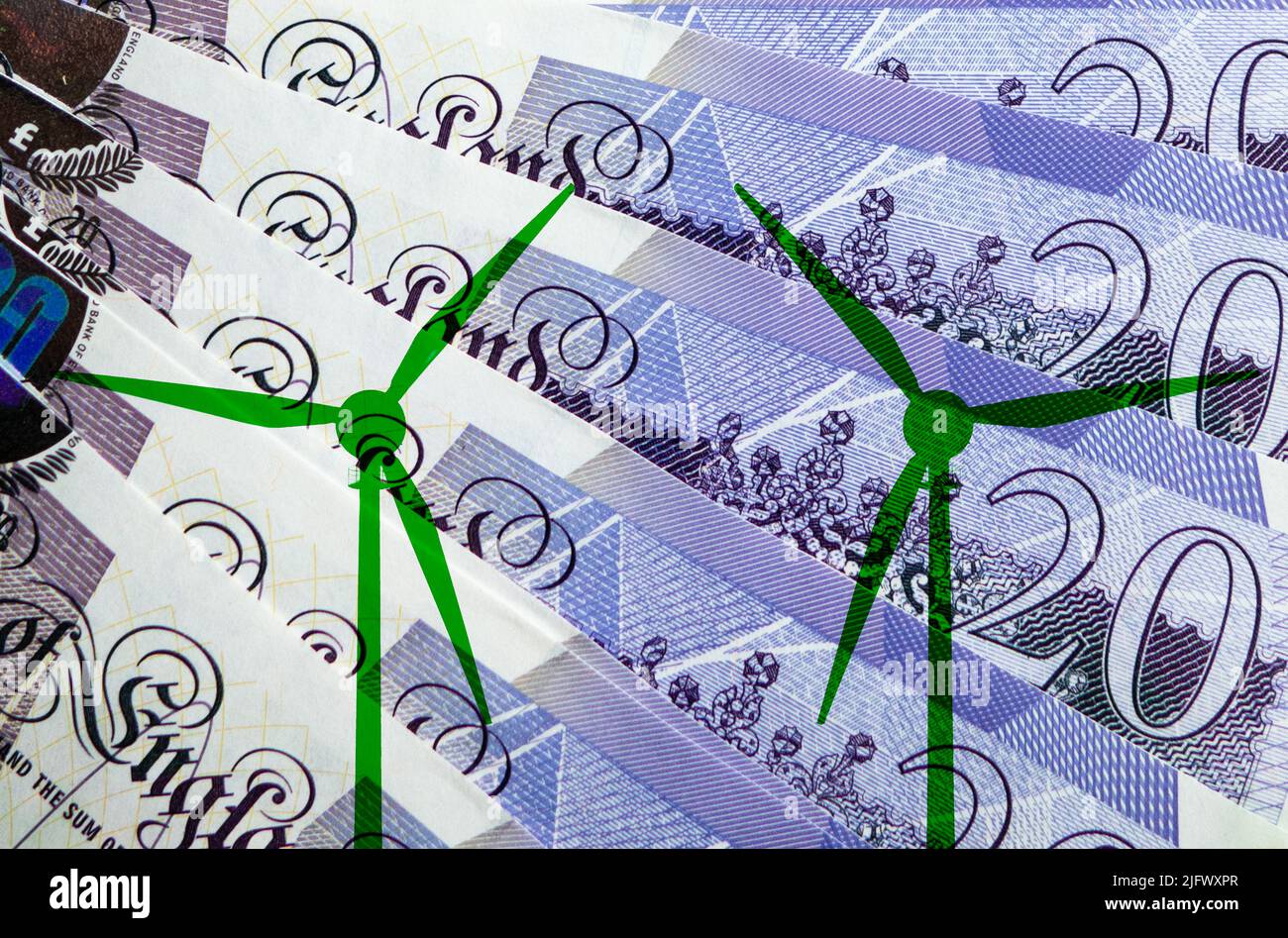 Green wind turbines with twenty pound notes background. green, clean renewable energy, greenwashing... concept. Stock Photo