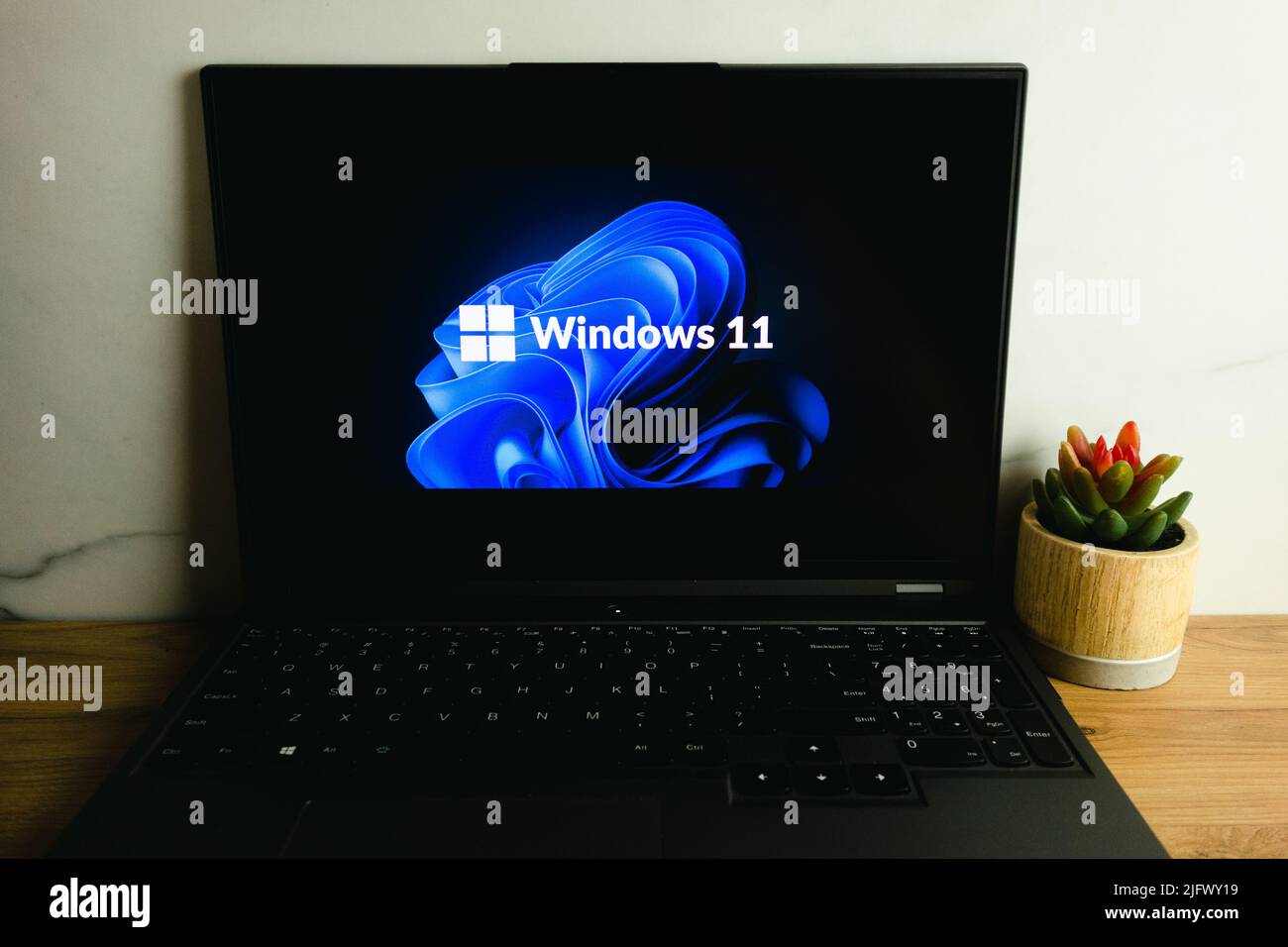 KONSKIE, POLAND - July 05, 2022: Microsoft Windows 11 operating system logo displayed on laptop computer screen Stock Photo