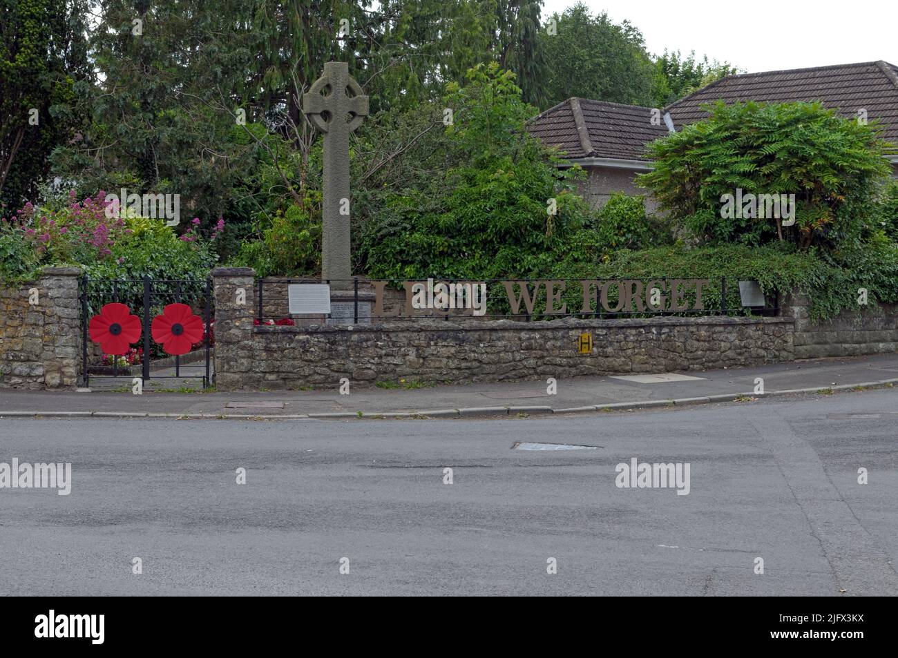 War memorial, Lest We Forget with poppies, Saltford village near Bristol, Scenes, June 2022 Stock Photo
