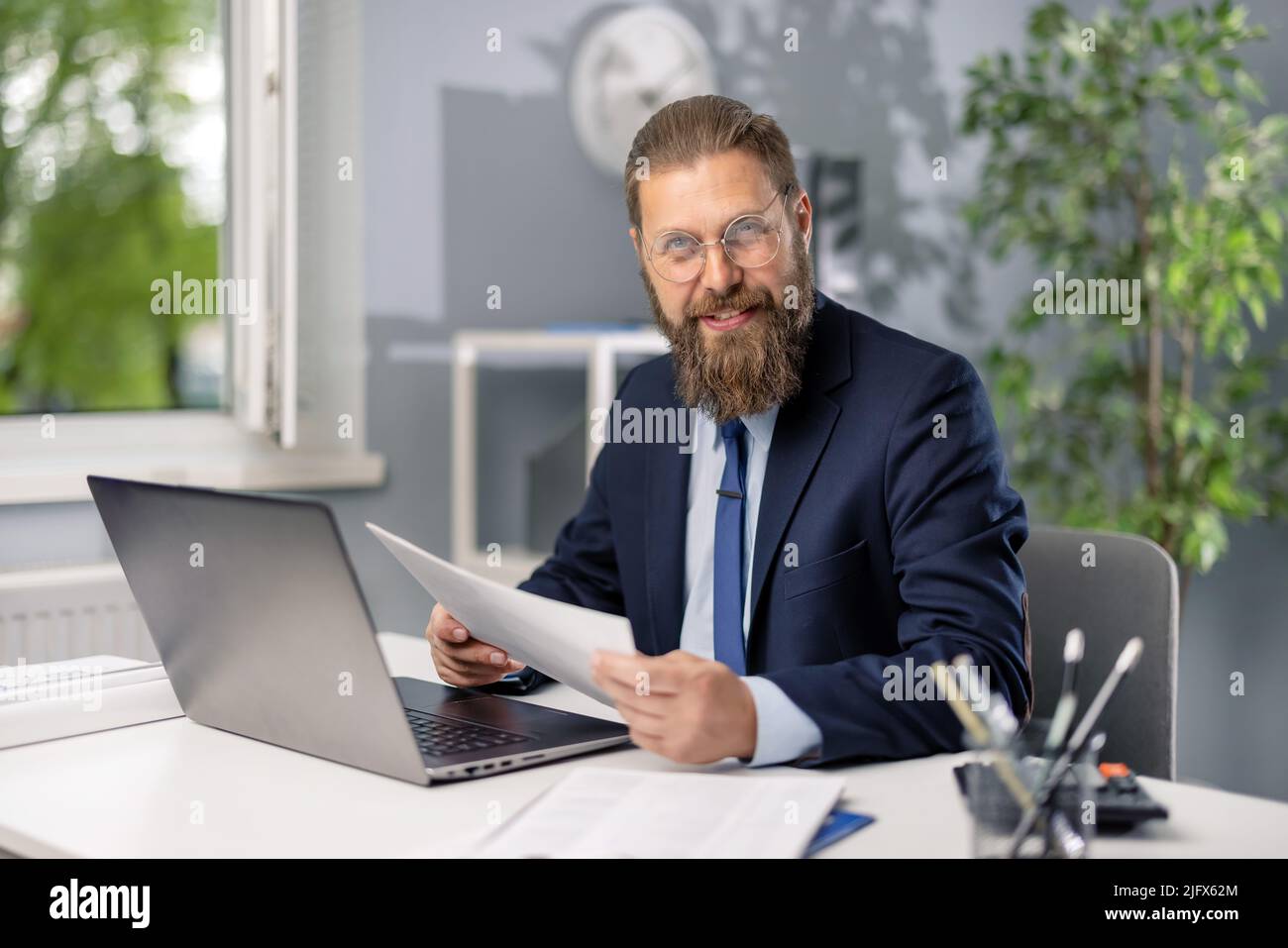 Happy man working in office Stock Photo