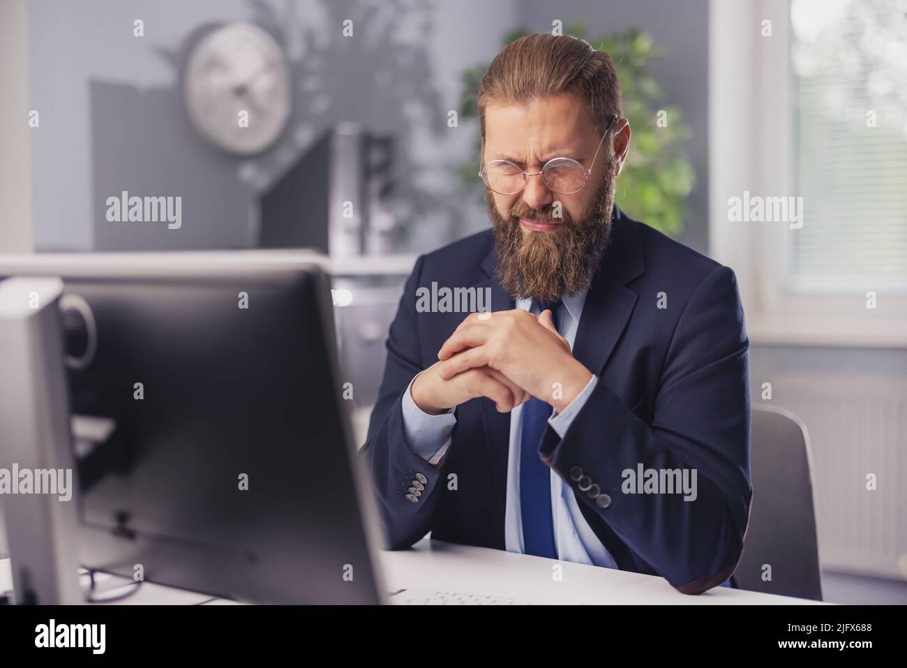 Businessman with wry grimace Stock Photo