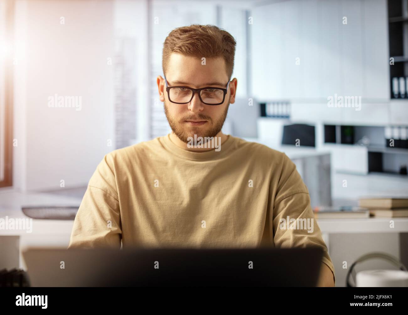 Man at office with laptop Stock Photo