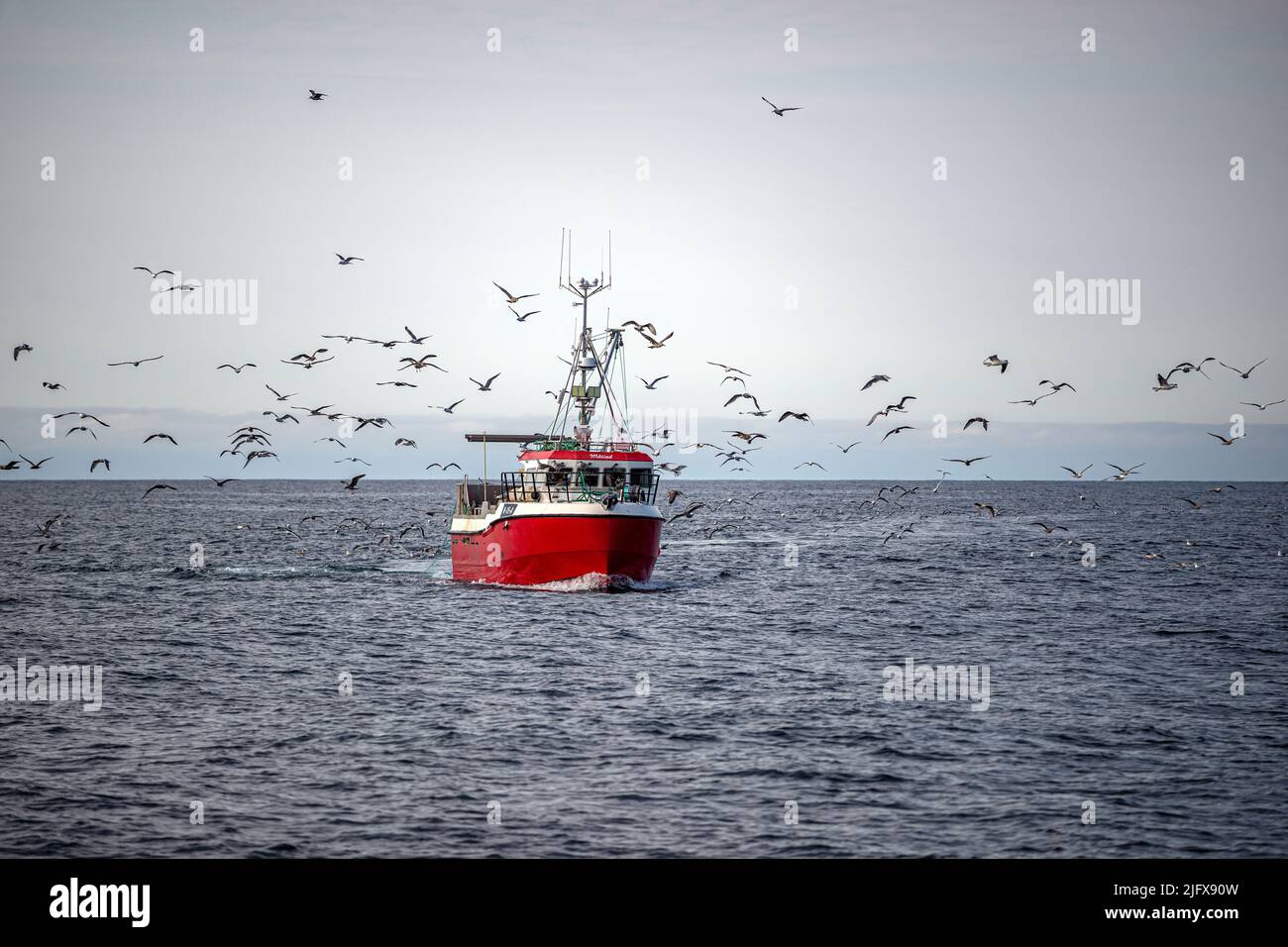 Red painted fishing boat, Andenes, Norway Stock Photo