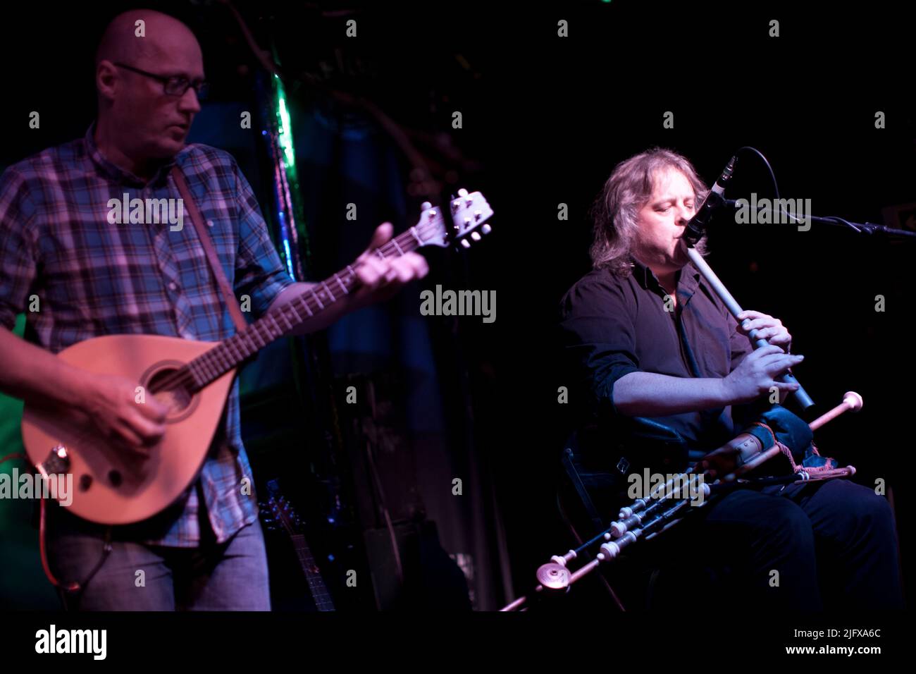 Fiddle player Andy Dinan, uillean pipes player Troy Donockley and Adrian Edmondson from The Bad Shepherds play the Fleece in Bristol as part of their First Farewell Tour. 28 October 2011. Stock Photo