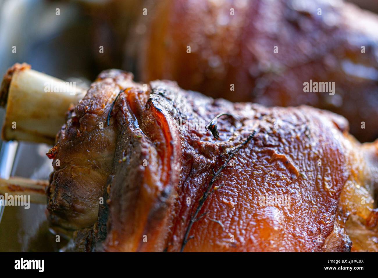 A closeup of delicious knuckle of pork in an oven Stock Photo