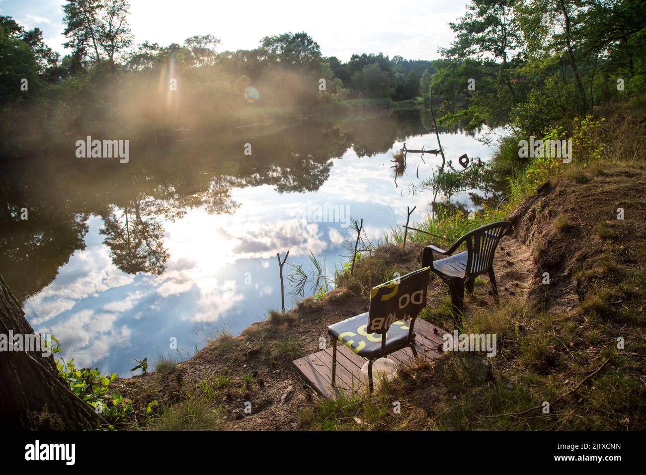 Fishing spot, Neisse river at sunset, photographed from the side of Poland Stock Photo