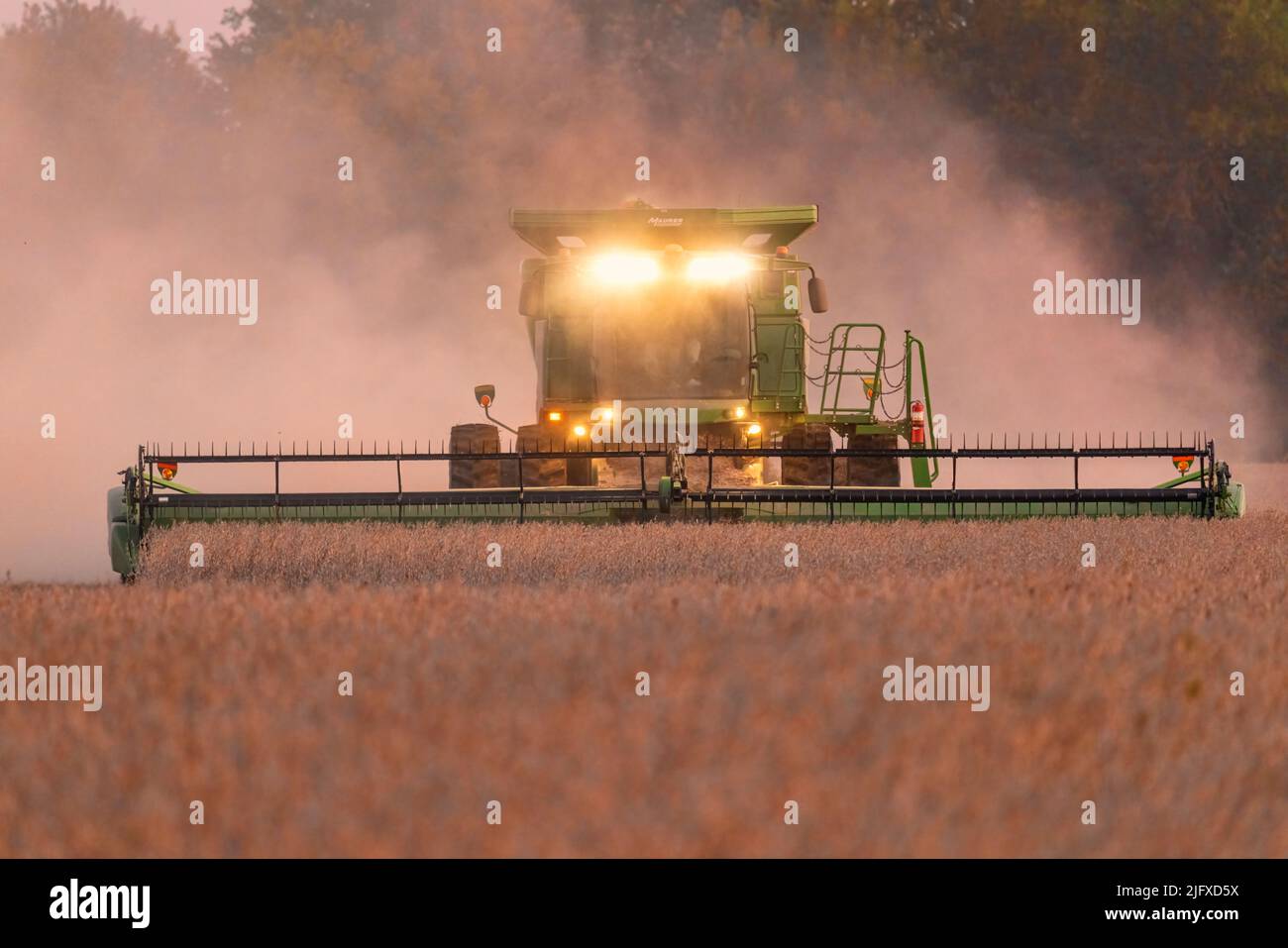 63801-21312 Farmer harvesting soybeans after sunset  Marion Co. IL Stock Photo