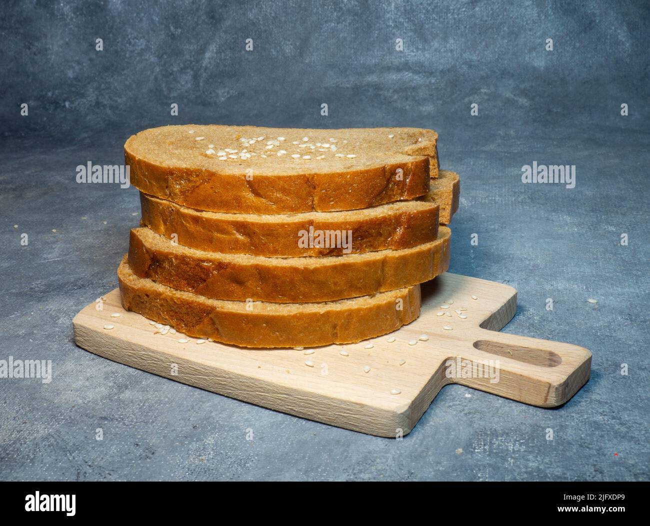 Evenly sliced bread for breakfast. Food on the table. Flour products