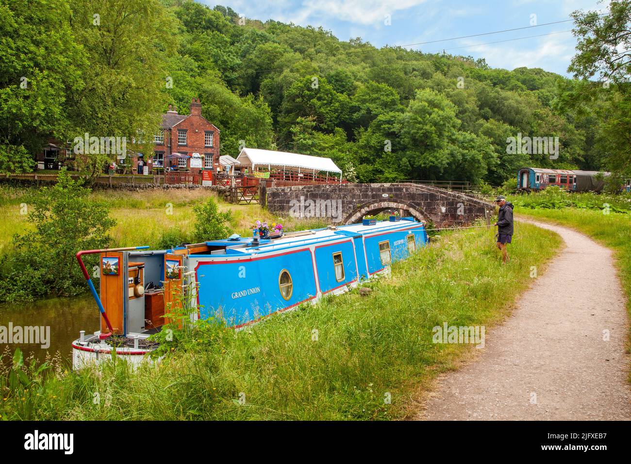 Canal narrowboat moored on the Caldon canal   the outside the Black Lion pub at Consall Wharf in the Churnet  valley Staffordshire England Stock Photo