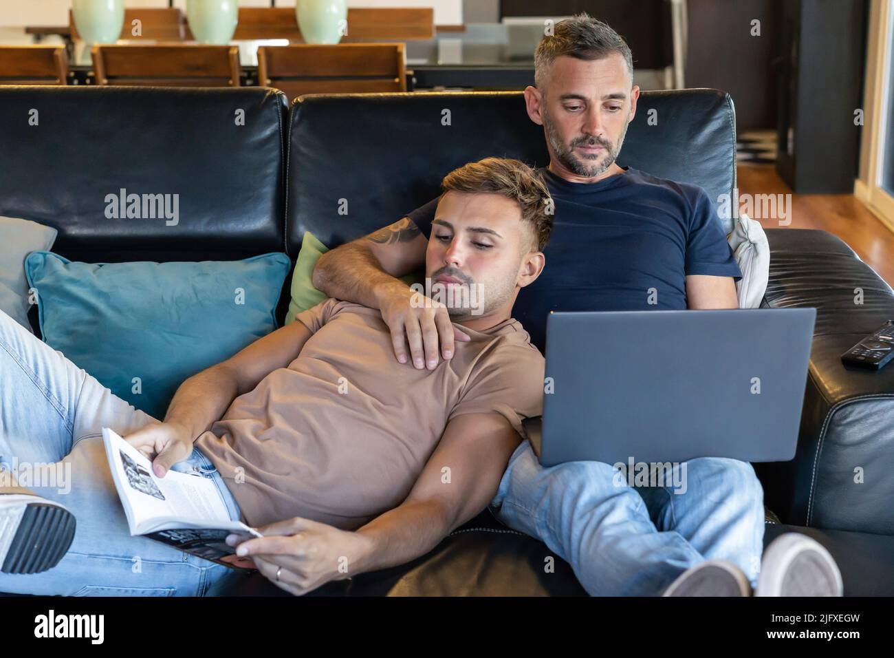 Two gay men holding other hi-res stock photography and images - Alamy