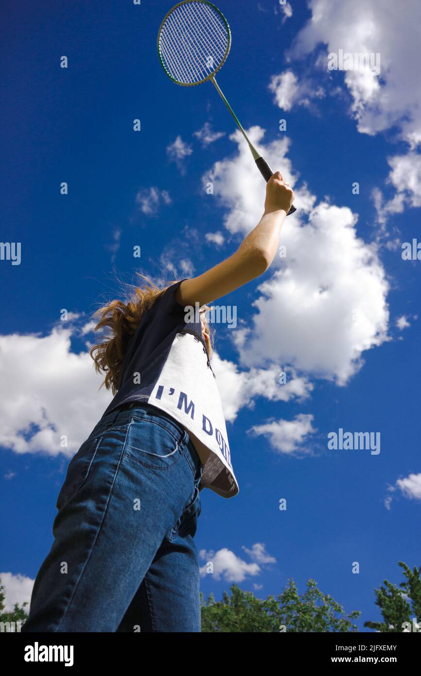 Young girl playing badminton outdoors Stock Photo Alamy
