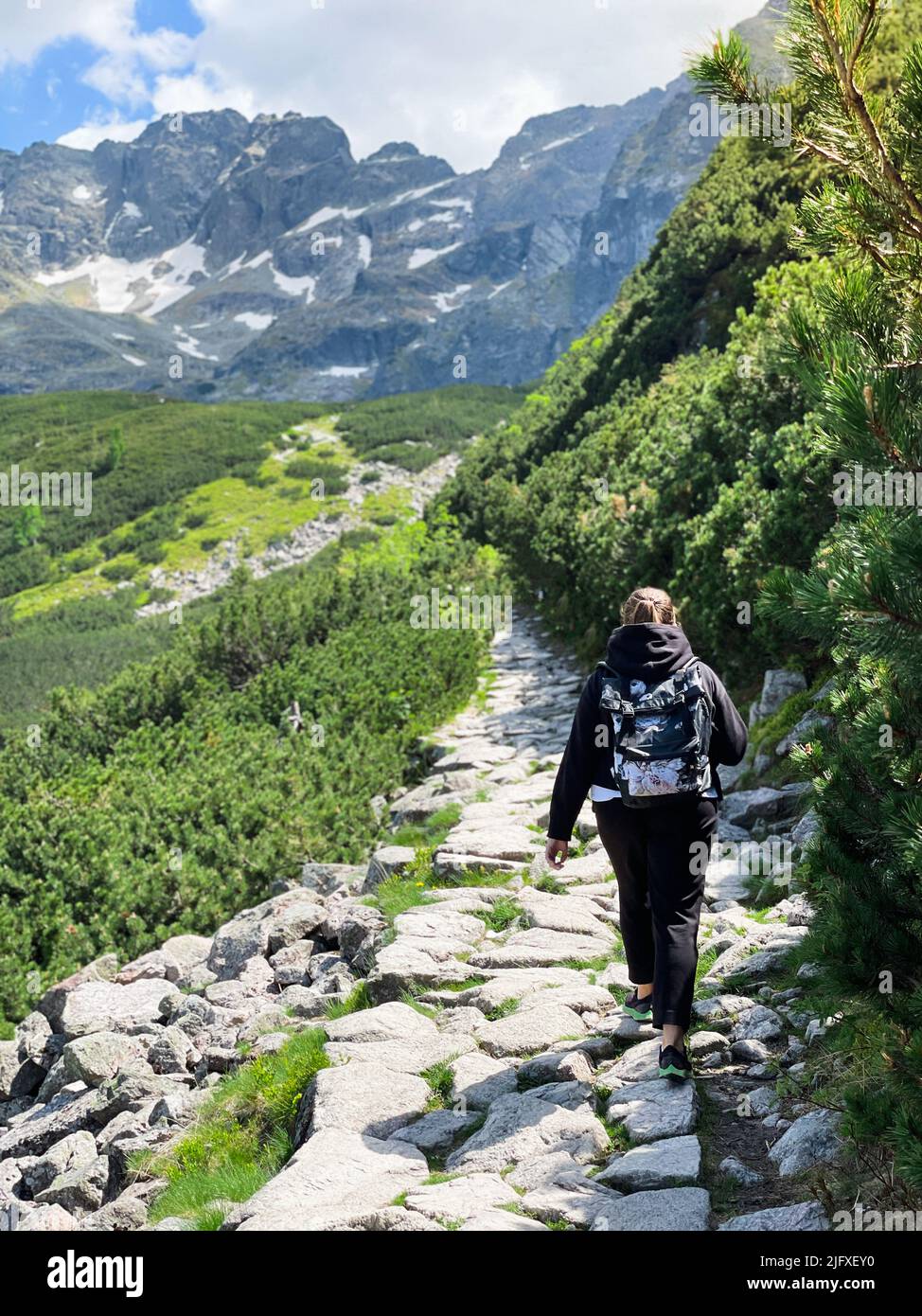 Woman tracking top mountain hi-res stock photography and images - Alamy