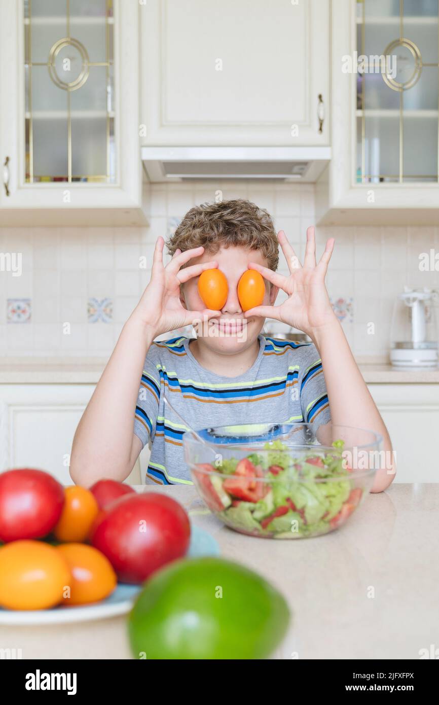 Portrait of a funny boy with tomatoes for eyes Stock Photo - Alamy