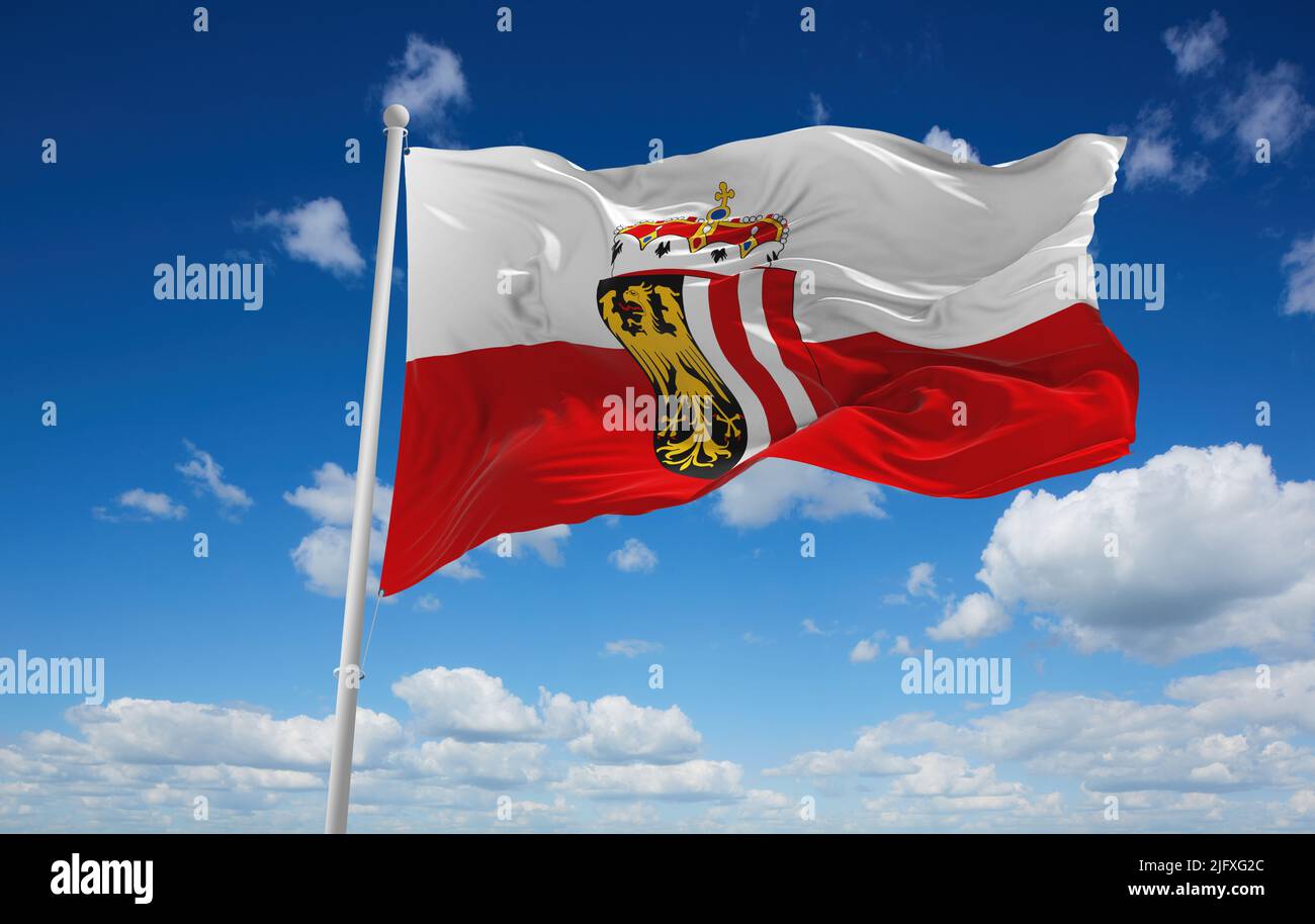 official flag of Upper Austria Austria at cloudy sky background on sunset,  panoramic view. Austrian travel and patriot concept. copy space for wide ba  Stock Photo - Alamy