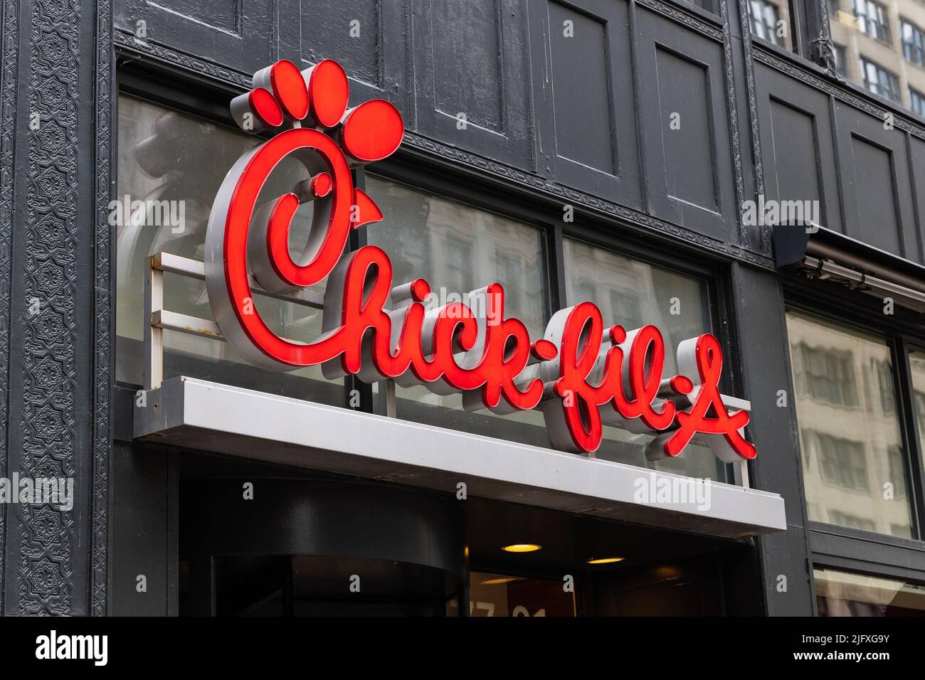 A Chick-Fil-A logo at a store in downtown Chicago. Chick-fil-A is one of the largest American fast food restaurant chains. Stock Photo