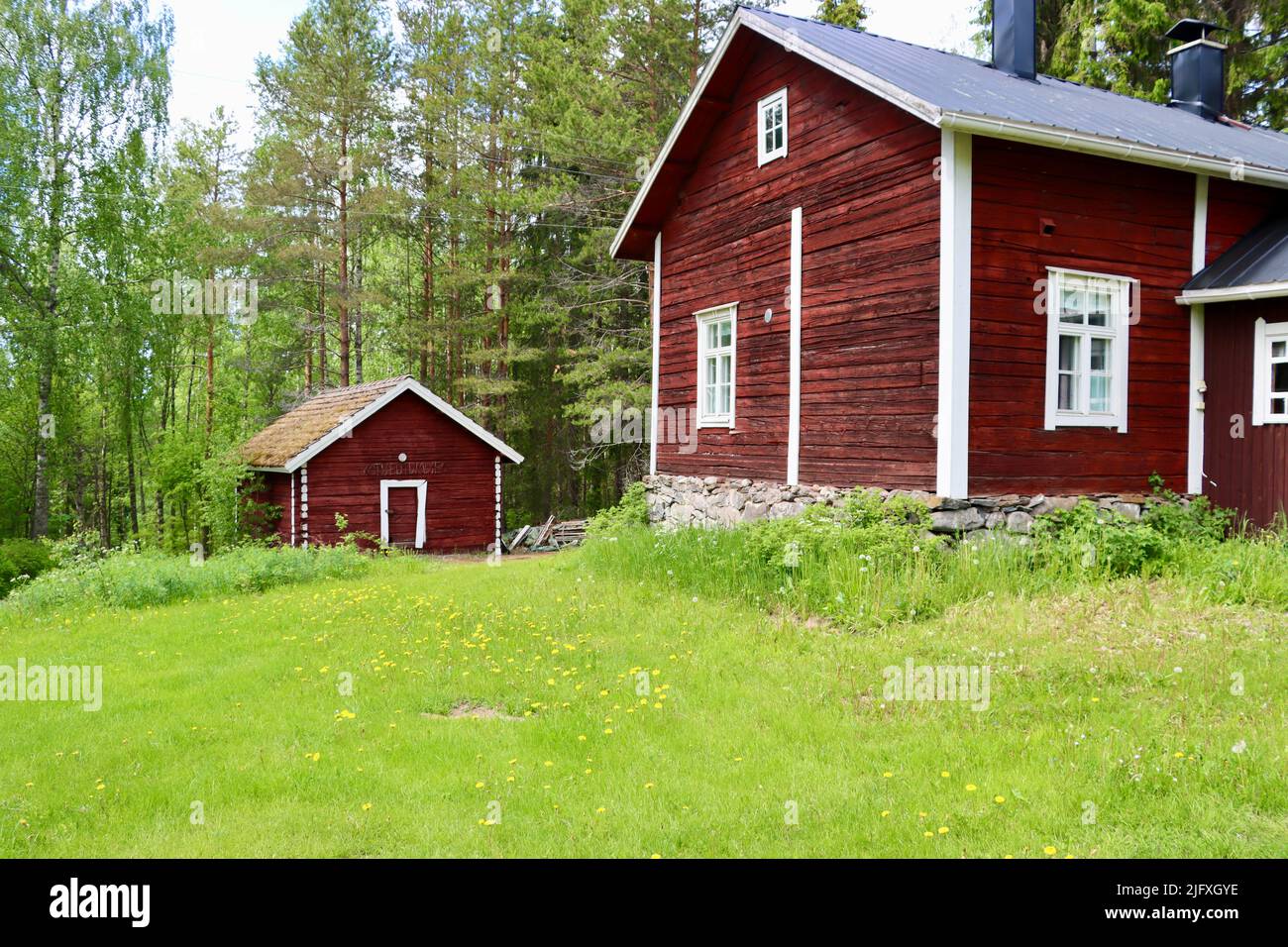 Old log building in Uukuniemi in Eastern Finland in June 2022 Stock Photo