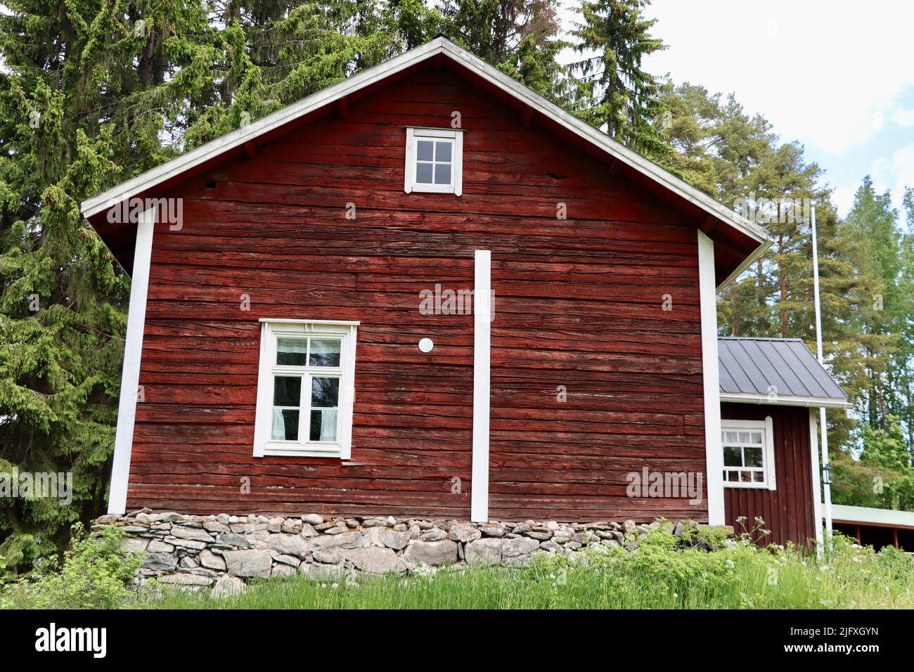 Old log building in Uukuniemi in Eastern Finland in June 2022 Stock Photo