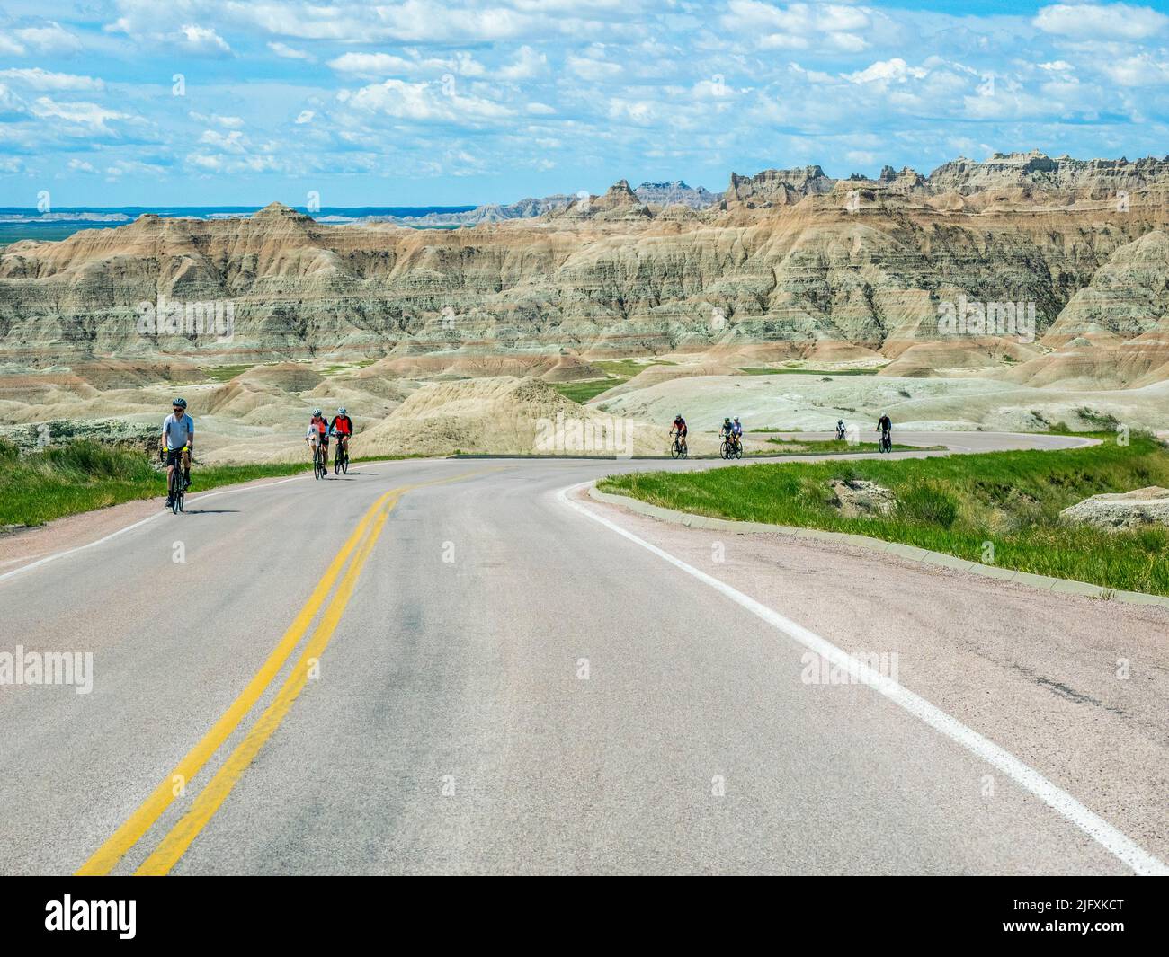 Bicycle riders on the Loop Road in Badlands National Park in South Dakota USA Stock Photo