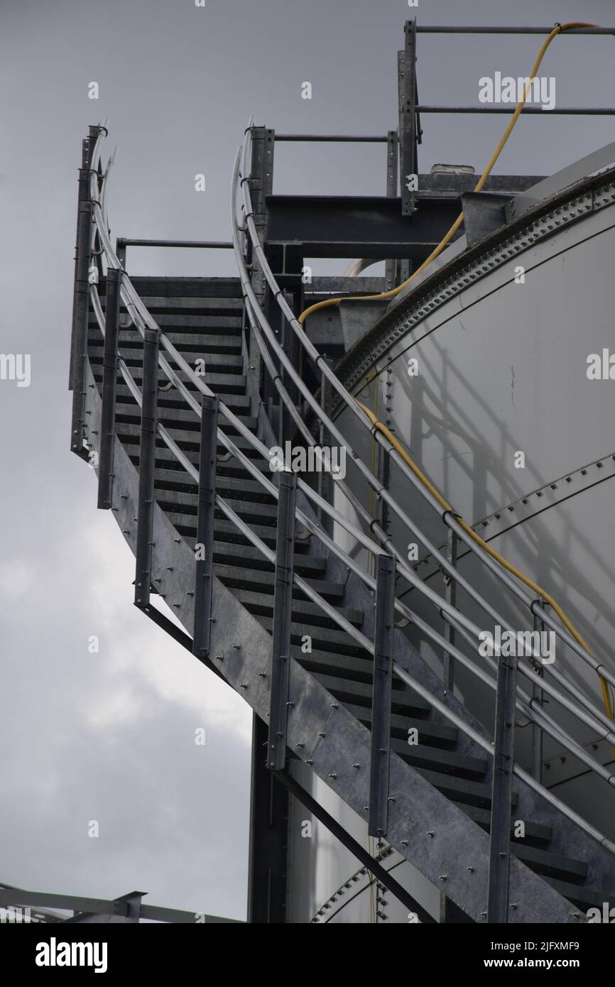 Staircase on the side of industrial steel container Stock Photo