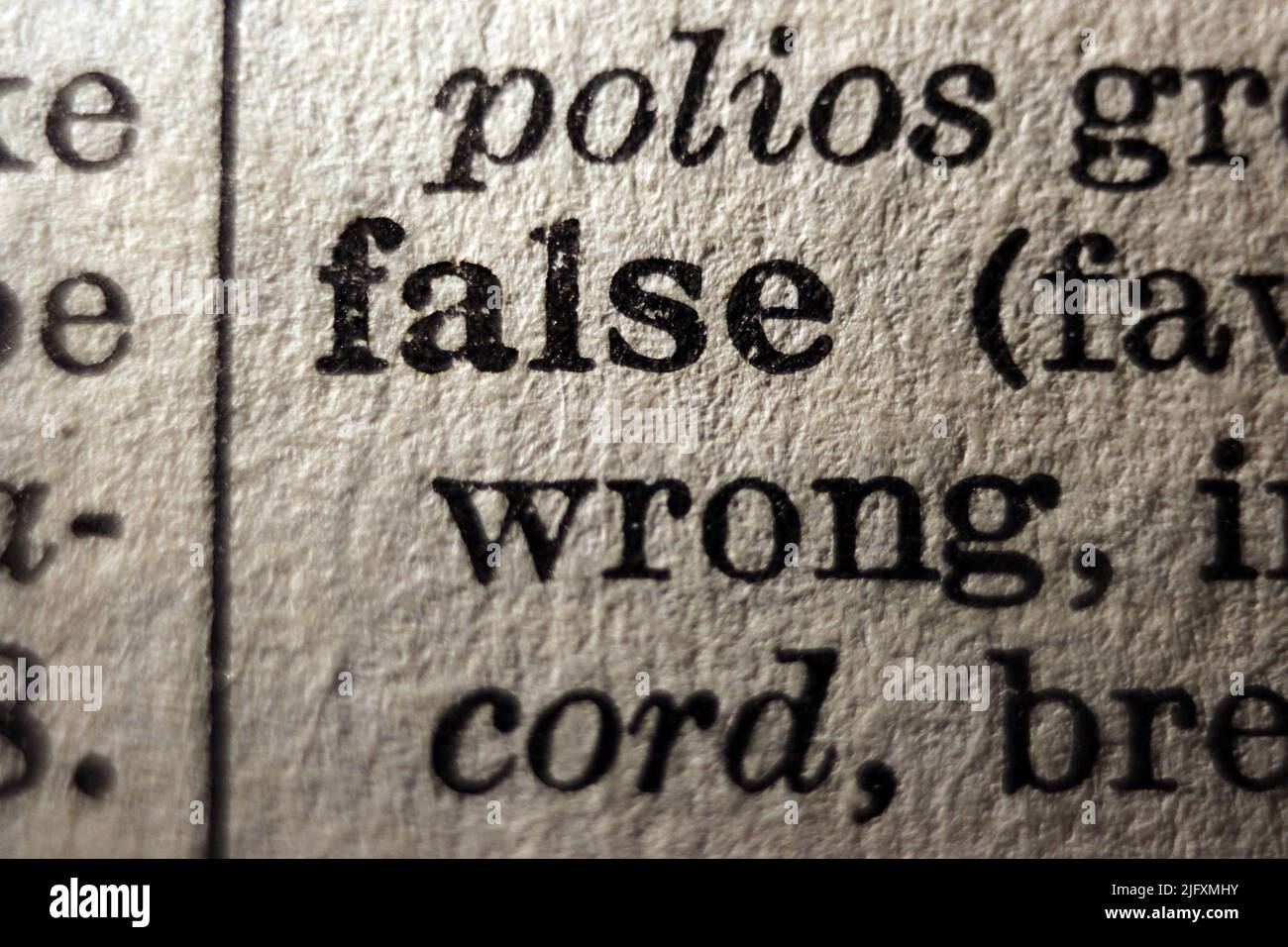 Definition of word false on dictionary page, close-up  close-up Stock Photo