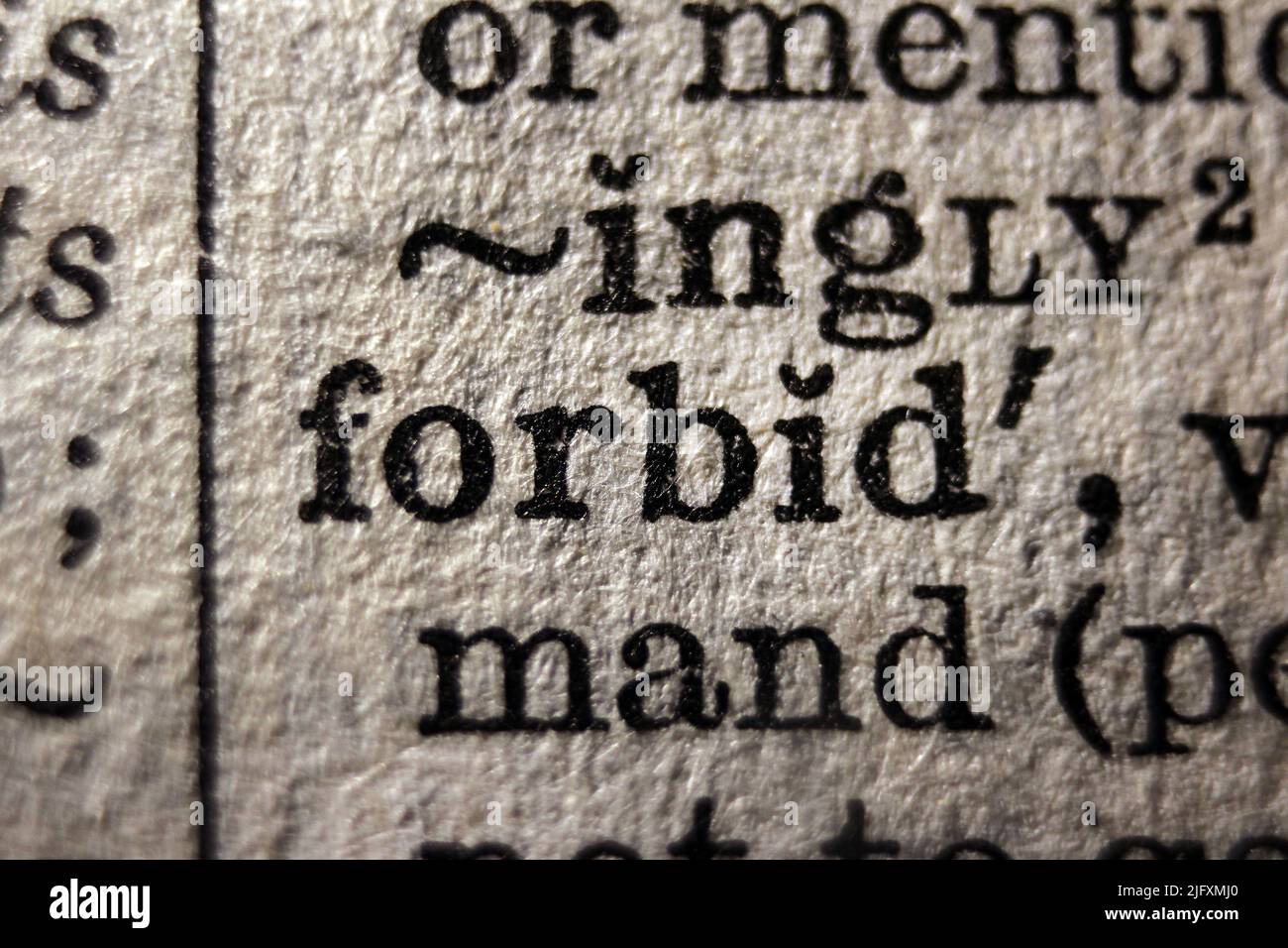 Definition of word forbid on dictionary page, closeup closeup Stock
