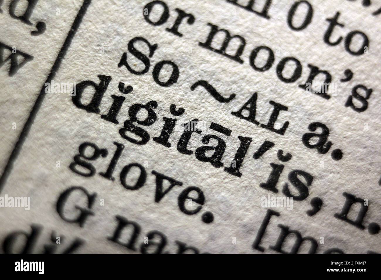 Word 'digital' printed on dictionary page, macro close-up Stock Photo