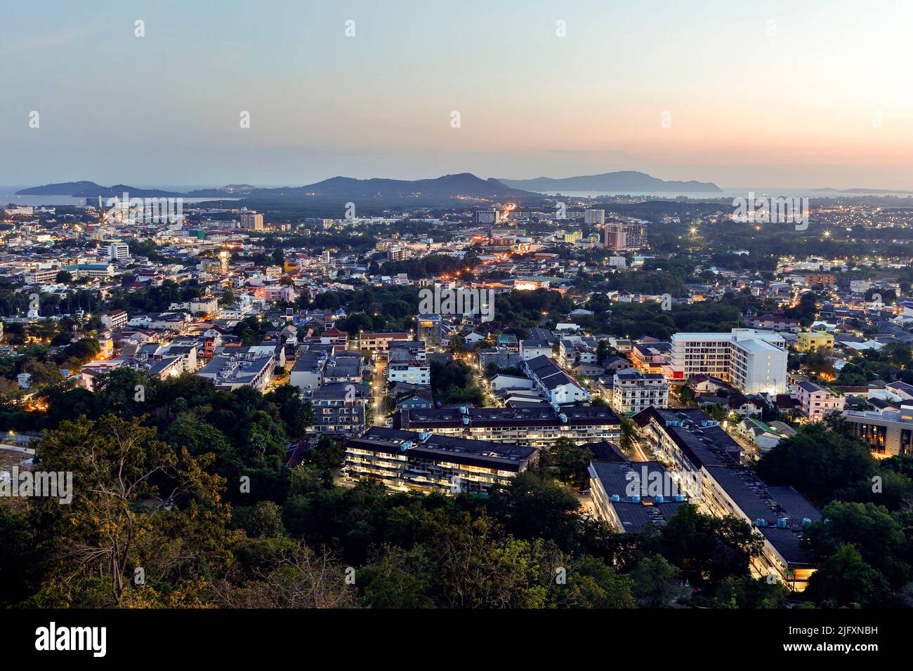 View of Phuket Town cityscape at dusk from Rang Hill (English) also known as Khao Rang (Thai). Phuket Town is the capital of Phuket Province in southe Stock Photo