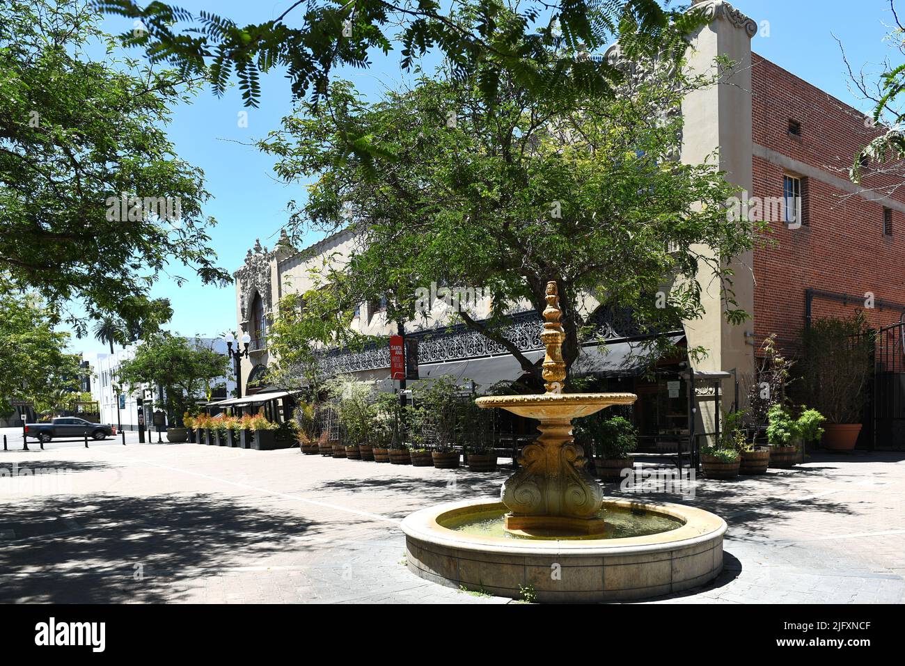 SANTA ANA, CALIFORNIA - 4 JUL 2022: Fountain and restaurant in the Artist District in Historic Downtown Santa Ana. Stock Photo