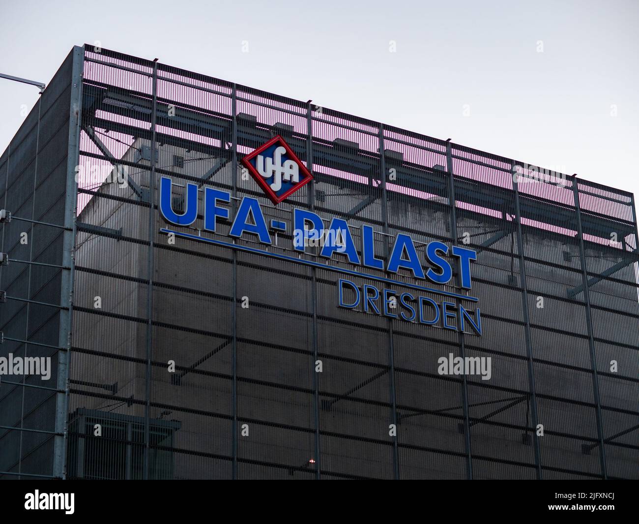 UFA Palast Dresden logo on the exterior wall of the building. One of the movie theaters in the city. Facade of a cinema in modern architecture. Stock Photo
