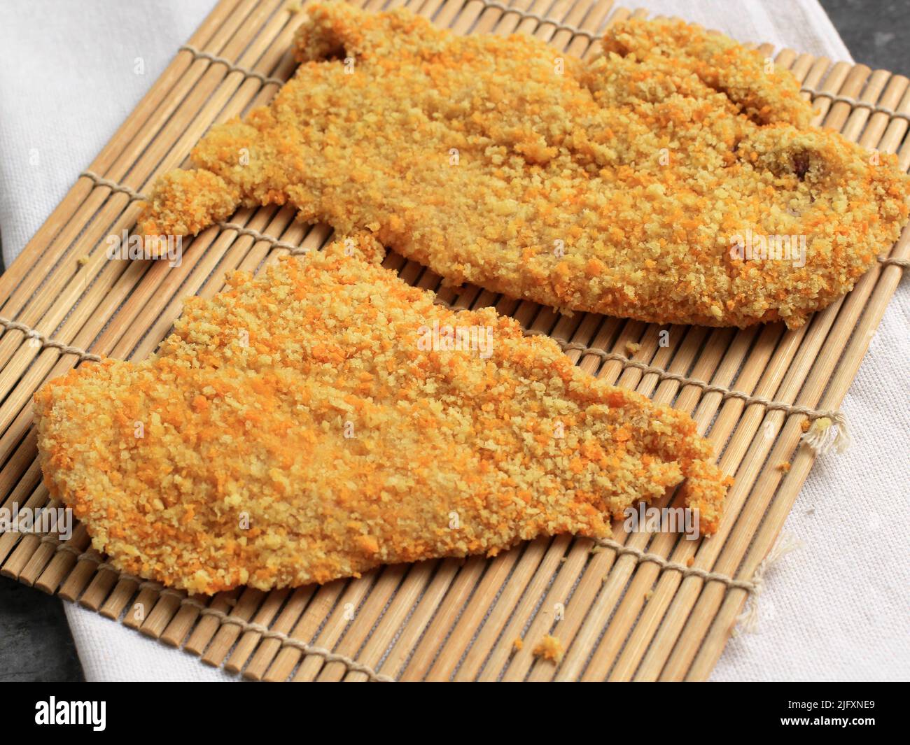Breaded Chicken Cutlet or Chicken Katsu over a Bamboo Board with ...