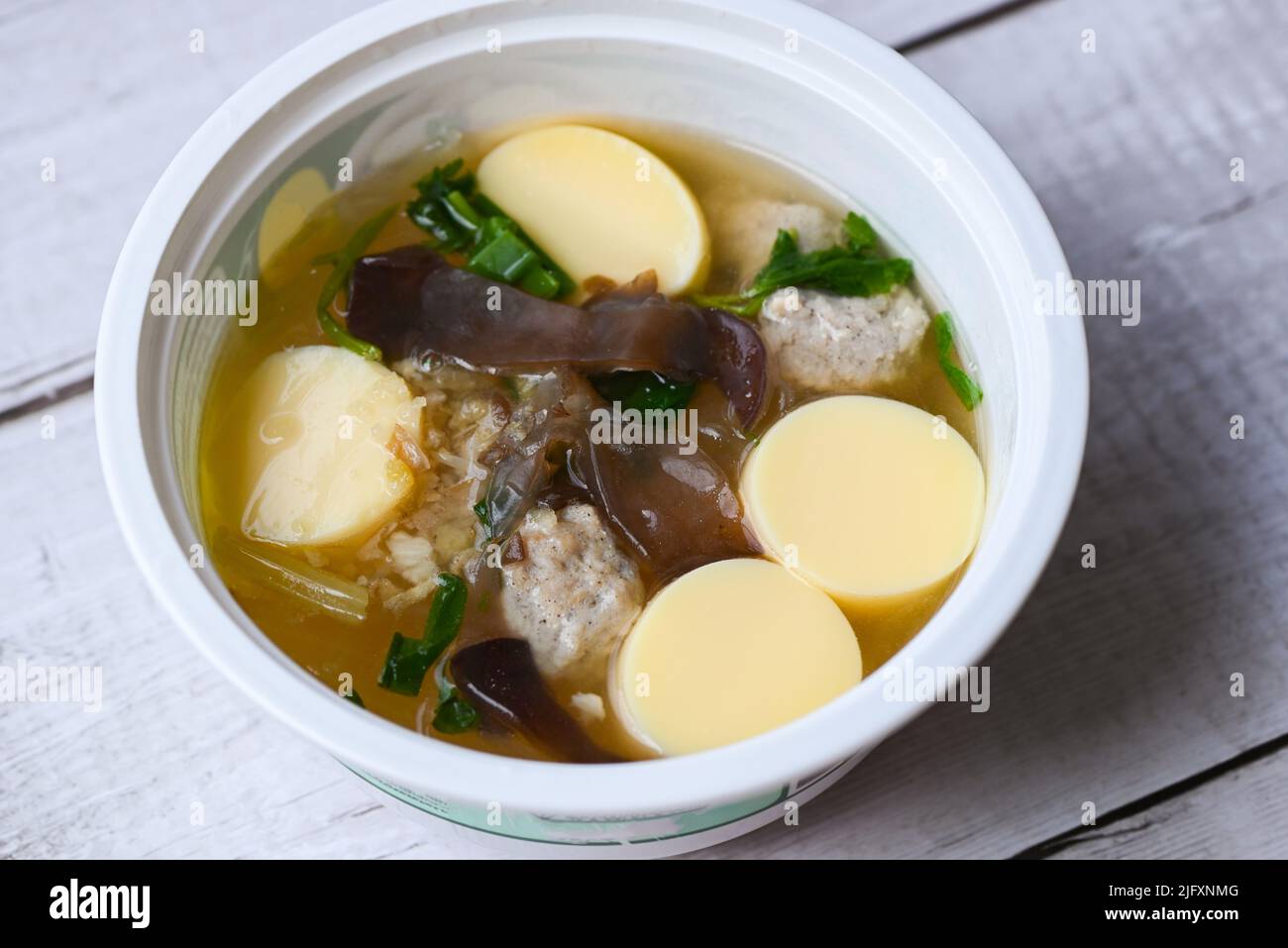clear soup bowl with pork jelly mushroom black jelly fungus vegetable