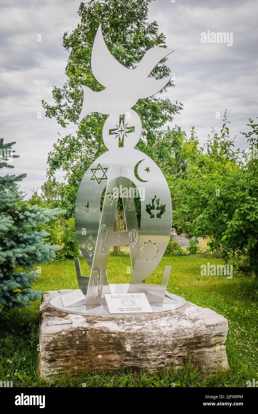 The Alpha and Omega Monument, offered by the Jesuits of Sudbury, at the Grotto of Our Lady of Lourdes, Sudbury, Ontario, Canada Stock Photo