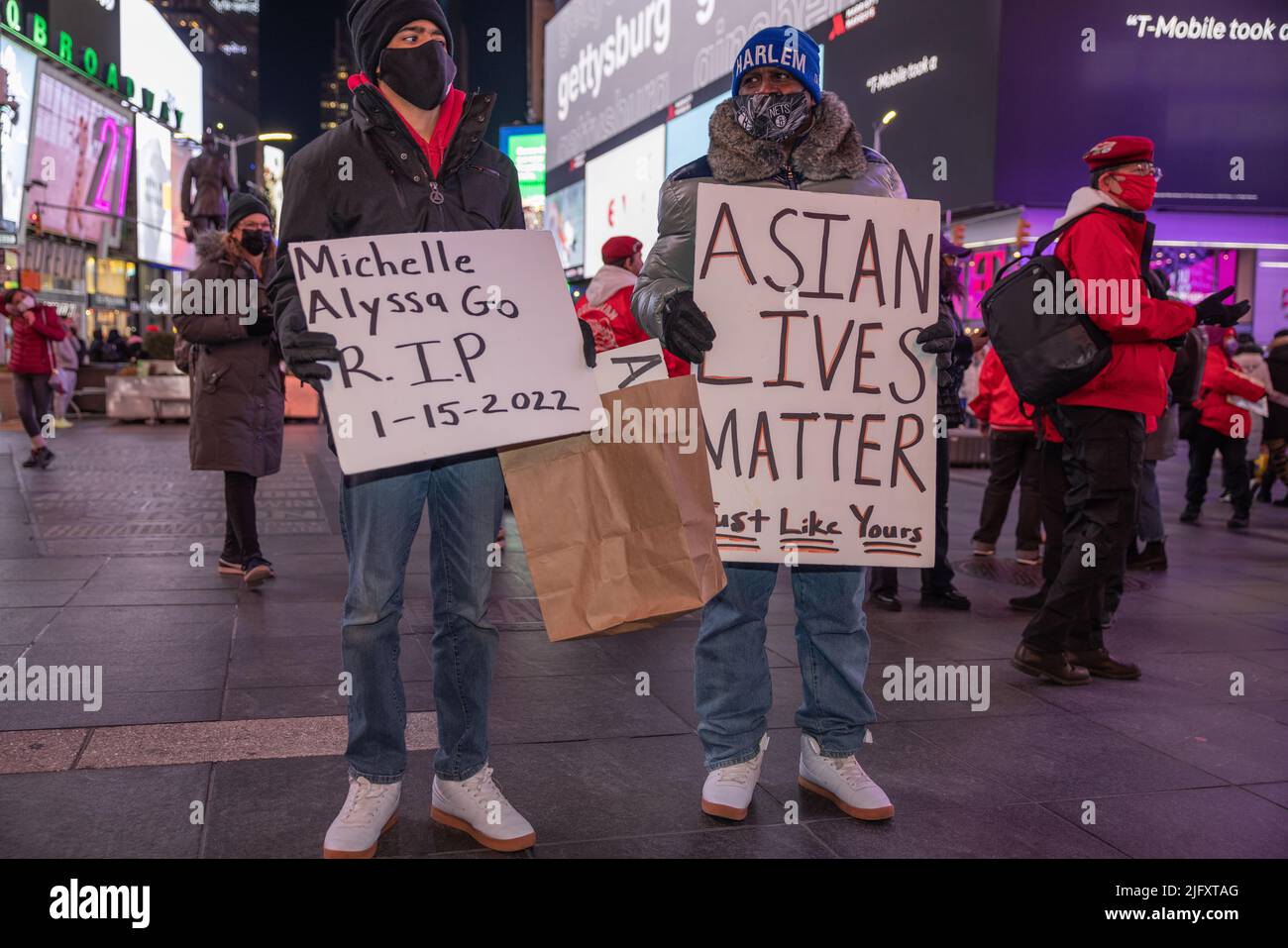 NEW YORK, N.Y. – January 18, 2022: People participate in a Times Square vigil for subway attack victim Michelle Alyssa Go. Stock Photo
