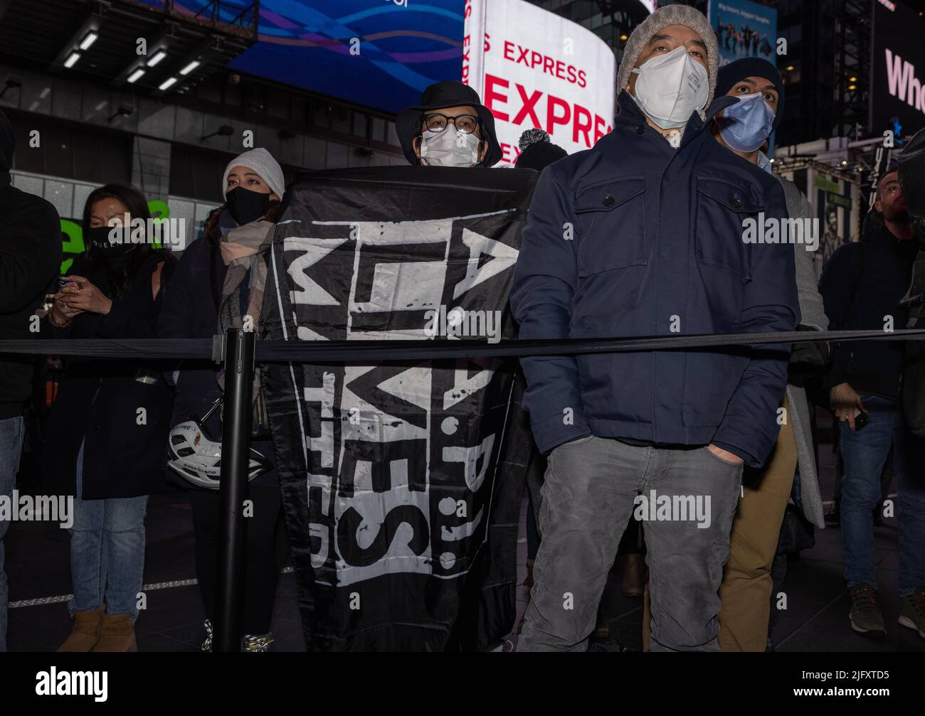 NEW YORK, N.Y. – January 18, 2022: People participate in a Times Square vigil for subway attack victim Michelle Alyssa Go. Stock Photo