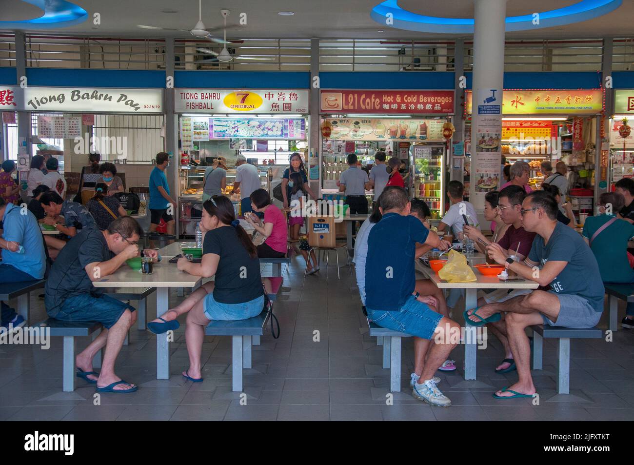 Diners at the food court (hawker centre) at Tiong Bahru, the oldest housing estate in Singapore, Stock Photo
