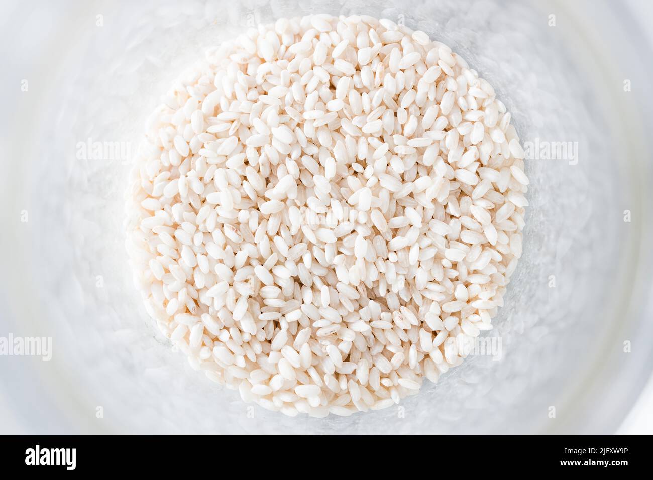 pantry jar with arborio risotto rice shot from top down perspective as