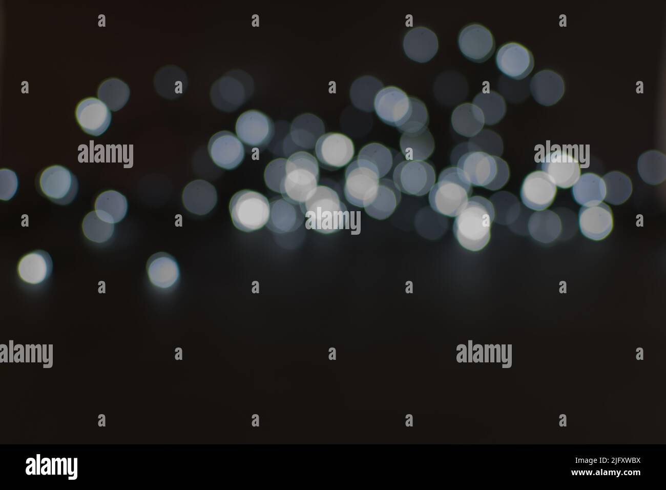 Background image with black and white bokeh lights Stock Photo - Alamy