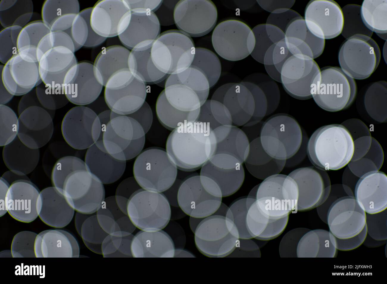 Background image with black and white bokeh lights Stock Photo - Alamy