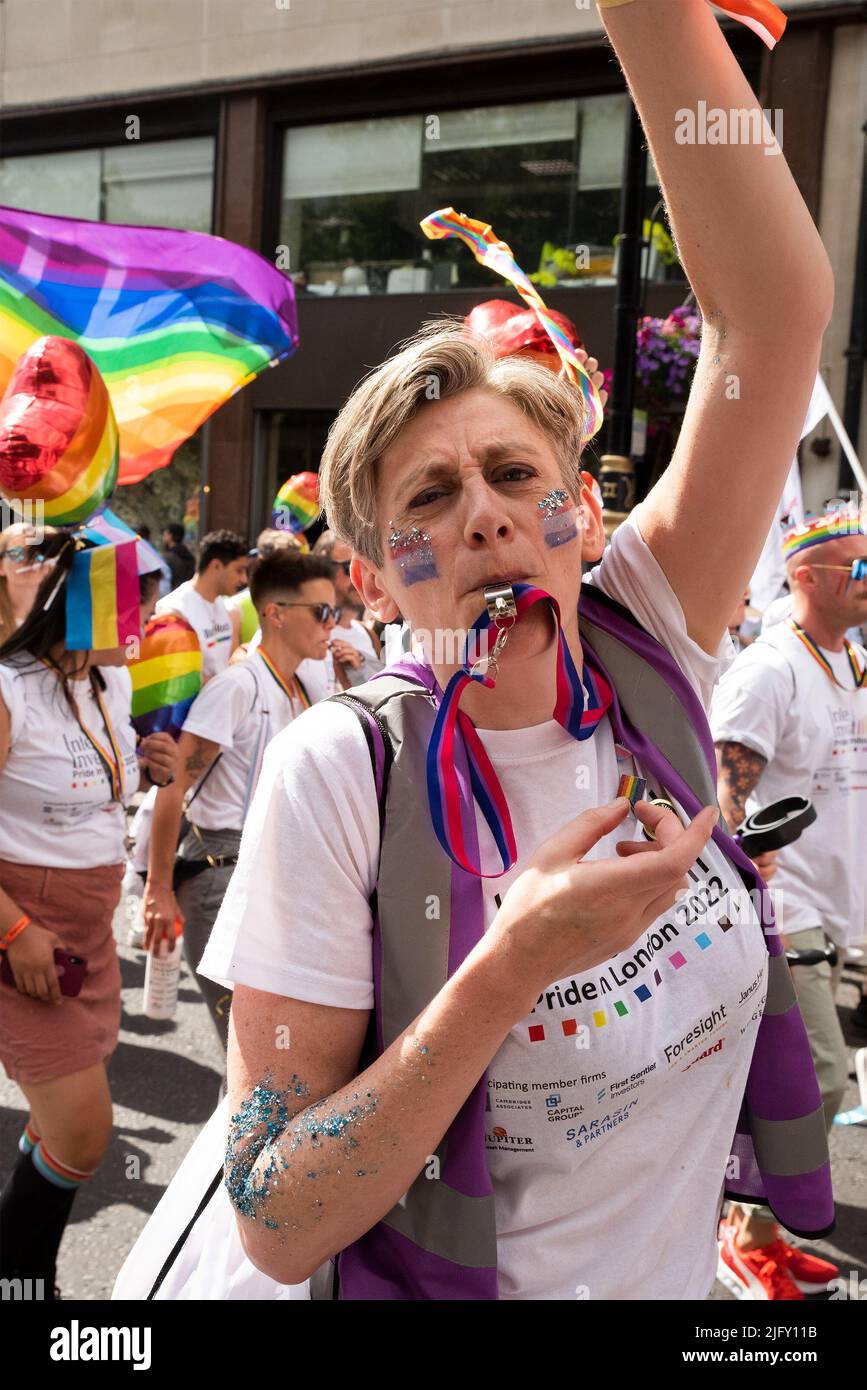 Piccadilly, London, UK. 2nd July 2022. London Pride March 2022. Celebrating 50 Years of Pride in the UK and following the same central London route taken in 1972. Pride marcher blowing whistle. Credit: Stephen Bell/Alamy Stock Photo