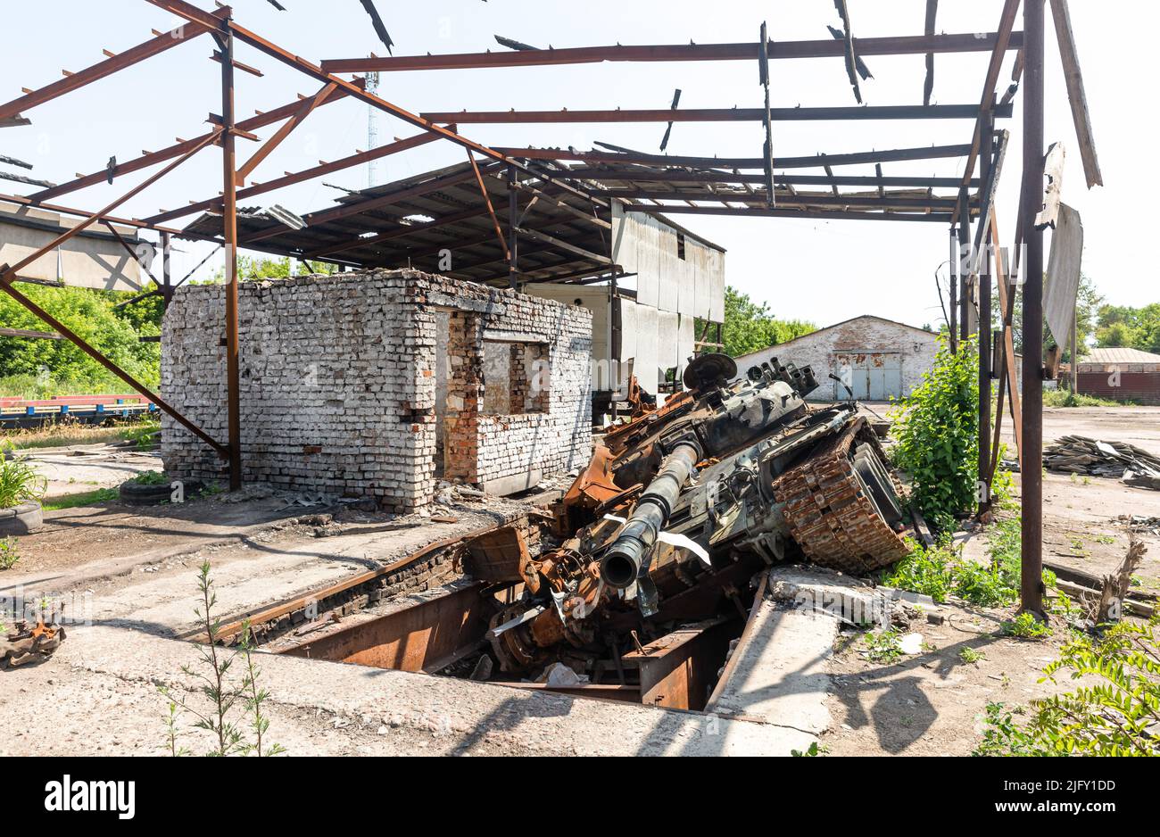 Destroyed Technical A view of a burnt and destroyed tank at a technical building destroyed ...