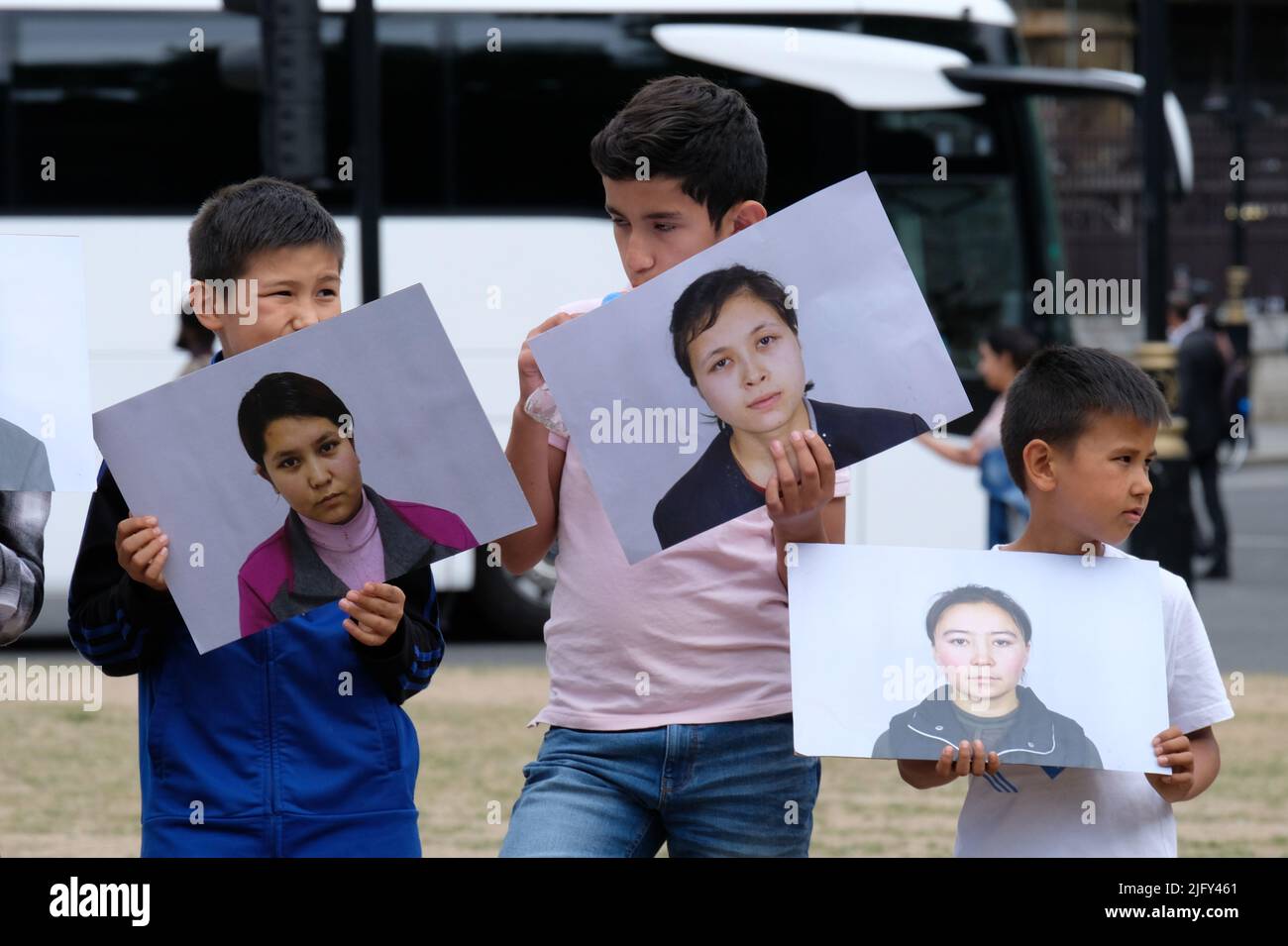 London, UK, 5th July, 2022. Uyghur activists and other supporters gathered on Parliament Square holding photos of missing individuals as they marked the 13th anniversary of the deadly Urumqi riot, which set the wheels in motion for the Chinese Communist Party (CCP) to introduce a surveillance state in the Xinjiang region, in addition to as internment camps, forced labour, sterilisation and other human rights abuses. Credit: Eleventh Hour Photography/Alamy Live News Stock Photo