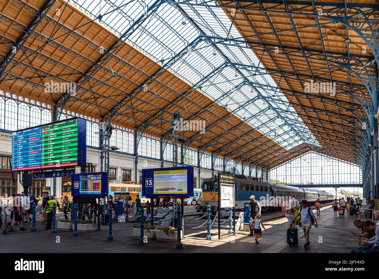 Commuters coming and going inside the Nyugati Railway Station in Budapest, Hungary Stock Photo