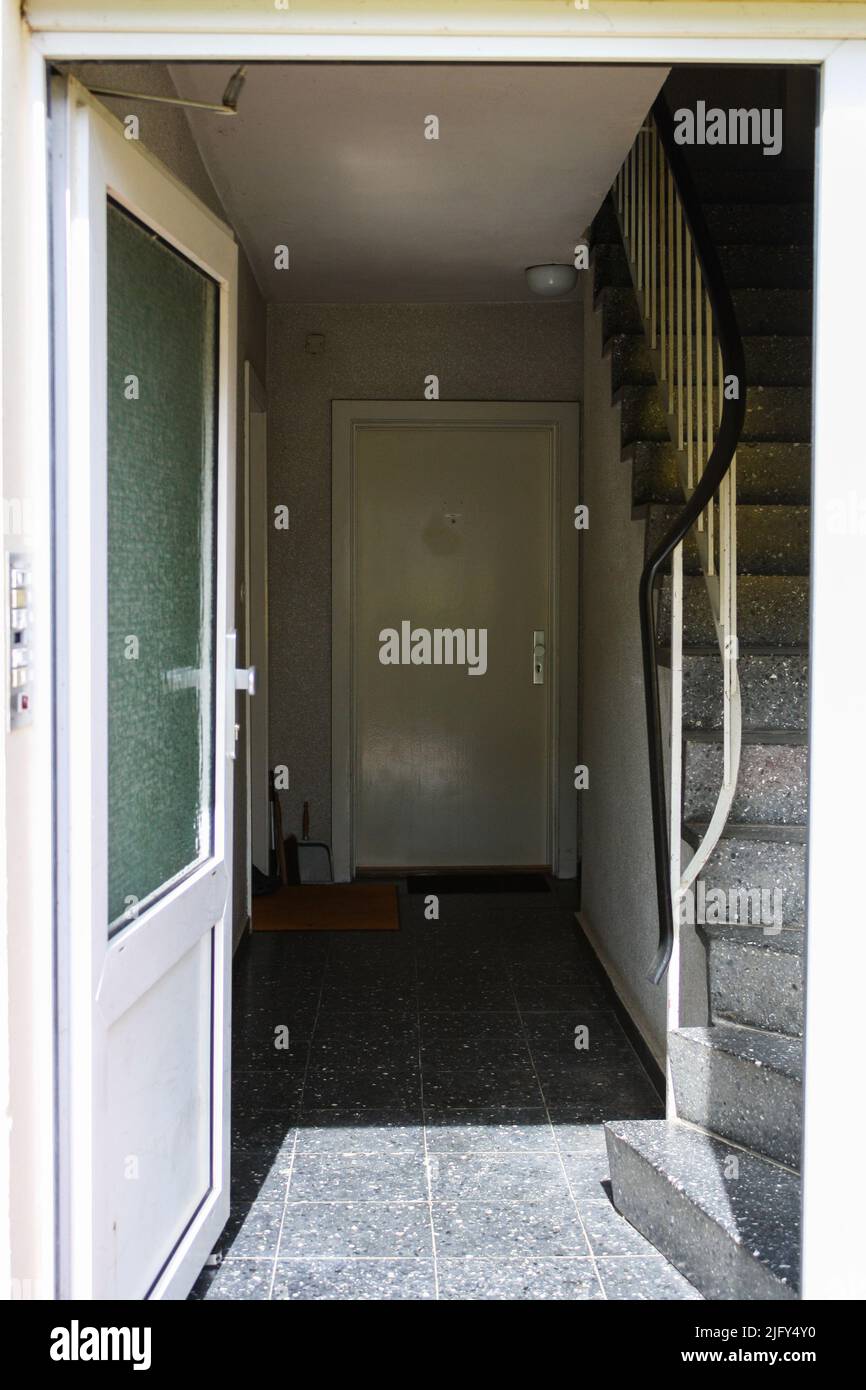 View of entrance of cheap apartment in Itzehoe, Germany with door open