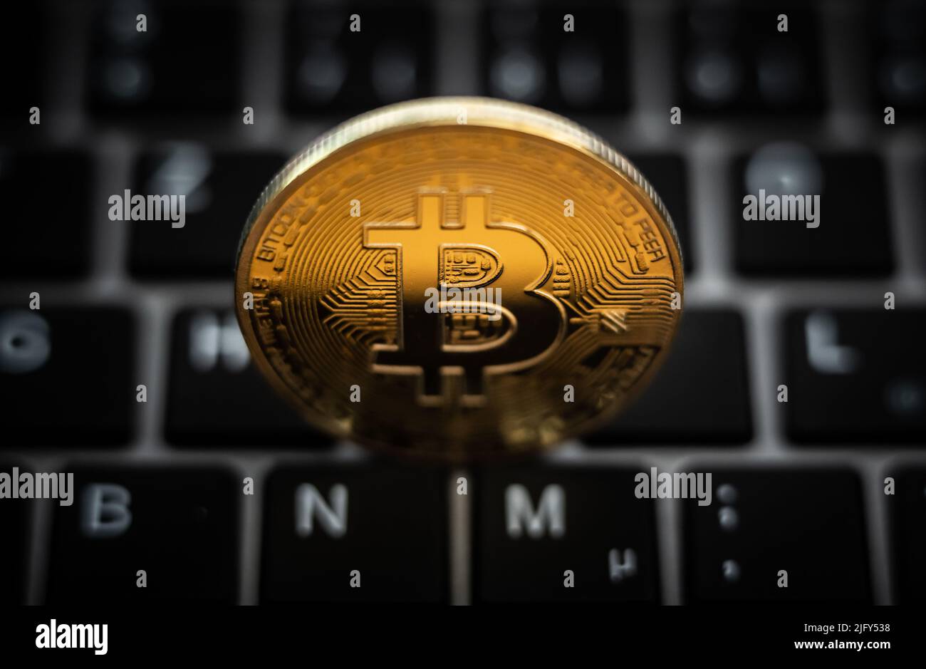 Rottweil, Germany. 05th July, 2022. A symbolic "Bitcoin coin" is seen on a  keyboard of a computer. Credit: Silas Stein/dpa/Alamy Live News Stock Photo  - Alamy
