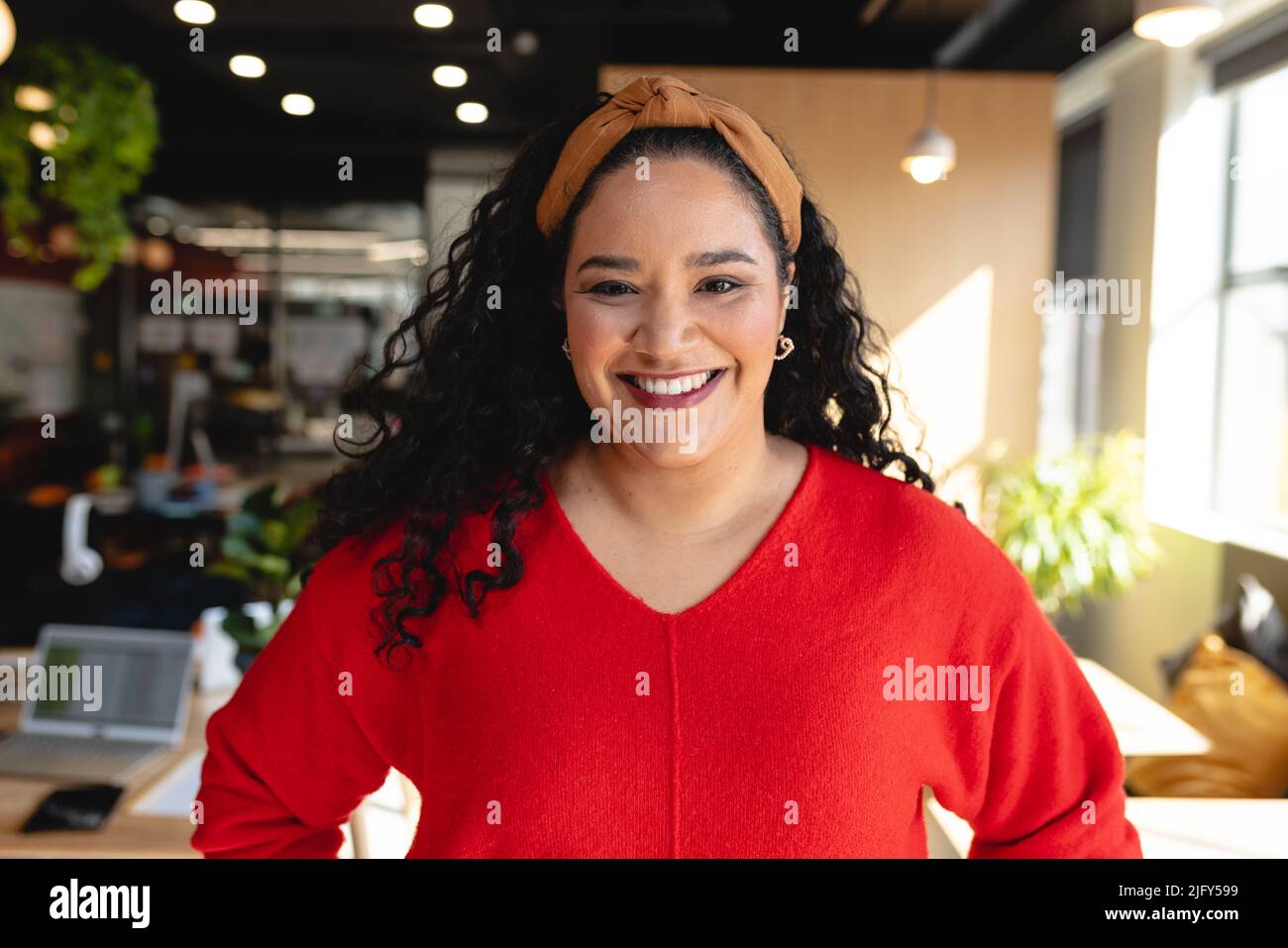 Portrait of happy biracial female design professional in creative office Stock Photo