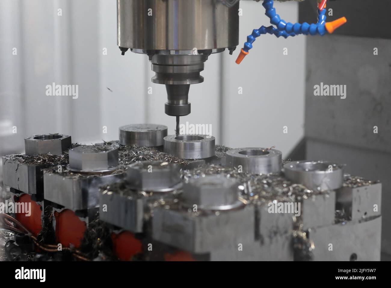 Drilling process with milling and drilling machine. Selective focus ...