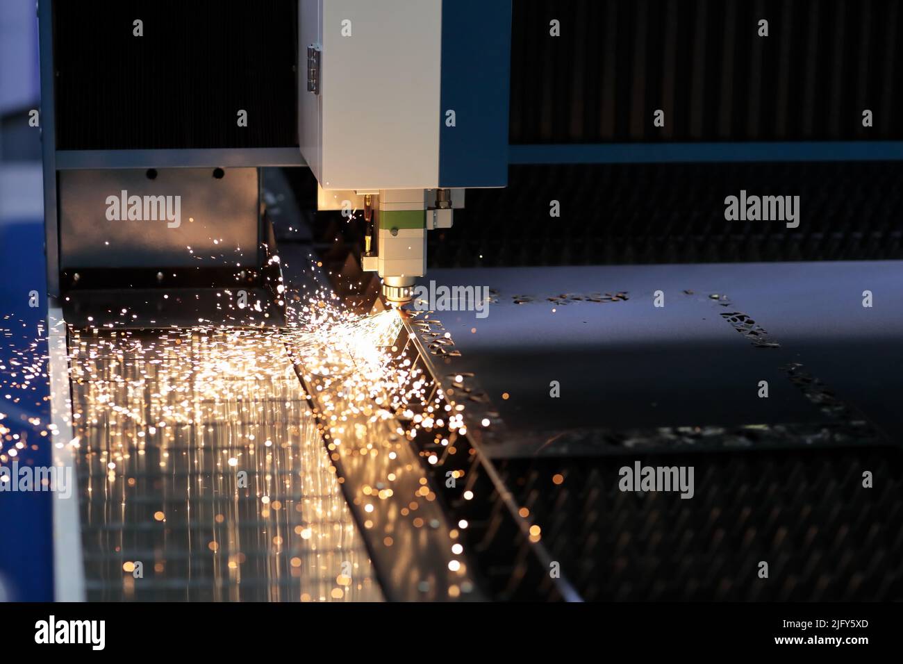 Metal sheet cutting process with CNC laser cutting machine. Selective